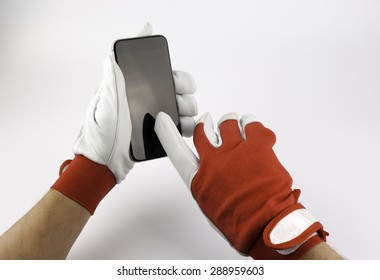 Leather Work Gloves And Mobile Phone.