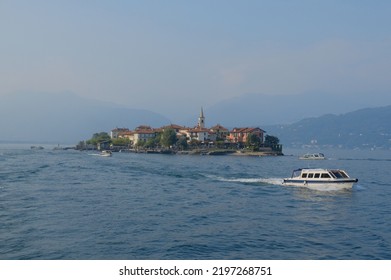 Leaving The Island Of Superiore In Italy. A Small Boat Ride Across The Lake, With A View So Beautiful That It Makes You Want To Cry.