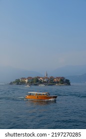 Leaving The Island Of Superiore In Italy. A Small Boat Ride Across The Lake, With A View So Beautiful That It Makes You Want To Cry.