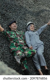 Lebaksiu , Indonesia - May 25 , 2021
A Couple Of Lovers Capture The Moment Before Marriage On A Small Rock Mound