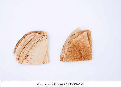 Lebanese Bread Cut In Half On White Background