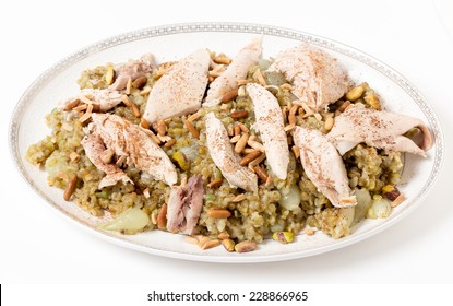 Lebanese cinnamon dusted chicken served on a bed of freekeh fire-dried green wheat with a garnish of toasted nuts. The grain, also spelt frikeh, has a low glycemic index and is high in fibre,