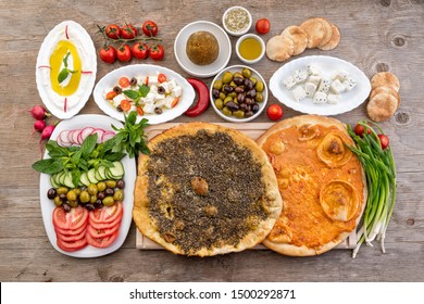 Lebanese Food Of Manakish, Lbaneh, Cheeses, Vegetables And Olives 