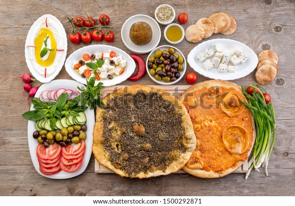 Lebanese food of Manakish, Lbaneh, cheeses, Vegetables\
and olives 