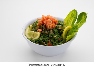 Lebanese traditional salad tabbouleh in a white bowl