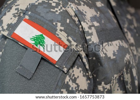Lebanon army uniform patch flag on soldiers arm. Military Concept.