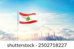 Lebanon flag wavering in beautiful clouds with building skyline. The flag with drone shot in beautiful sky. Lebanon national flag for independence day.