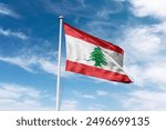 Lebanon flag waving at cloudy sky background. Republic of Lebanon flag.