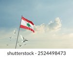 Lebanon flag waving with flying doves in beautiful sky. Lebanon flag for Republic Day and Independence Day.