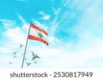 Lebanon flag waving with flying doves in beautiful sky. Lebanon flag for Republic Day and Independence Day.