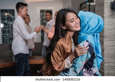 Lebaran homecoming in his hometown greet each other apologizing with friends during the Eid