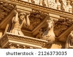 Lecce, Puglia, Italy. August 2021. The church of Santa Croce is the finest example of Lecce baroque. Detail of the facade illuminated by the warm light of the evening.