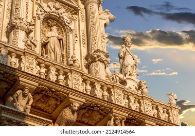 Lecce, Puglia, Italy. August 2021. The church of Santa Croce is the finest example of Lecce baroque. Detail of the facade illuminated by the warm light of the evening.