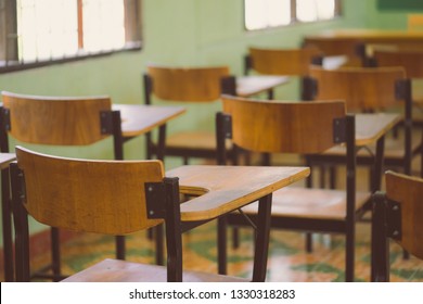 Lecture Room Or Examination Room.School Empty Classroom With Desks And Chair For Studying Lessons And Examination In School At Thailand.Interior Of Secondary Education With Whiteboard.vintage Tone.