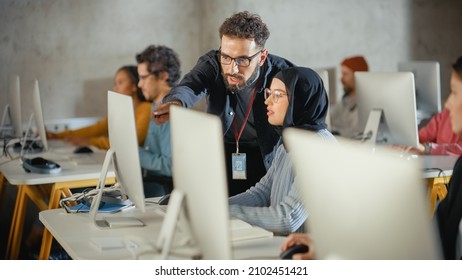 Lecturer Helps Scholar with Project, Advising on Their Work. Teacher Giving Lesson to Diverse Multiethnic Group of Female and Male Students in College Room, Teaching New Academic Skills on a Computer. - Powered by Shutterstock