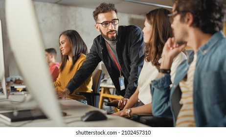Lecturer Helps Scholar with Project, Advising on Their Work. Teacher Giving Lesson to Diverse Multiethnic Group of Female and Male Students in College, Teaching Computer Science and Writing Code. - Shutterstock ID 2102457310