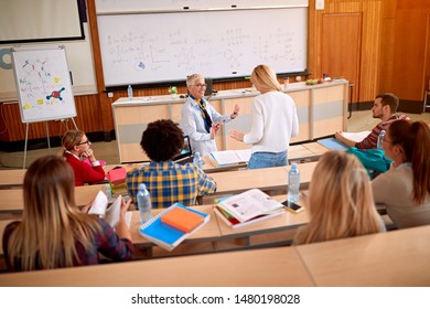 lecturer in training class with young students - Shutterstock ID 1480198028