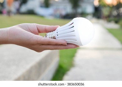 LED Bulb With Lighting In Human Hand