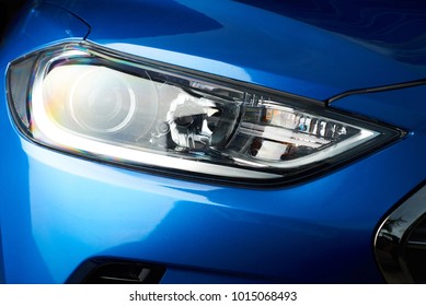 Led car headlight close-up. New modern vehicle detail of lamps light