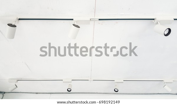 Led Downlight Installation On White Ceiling Stock Photo