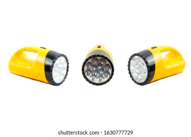 LED Flashlight, Set Of Yellow And Black Handle, Torch Head Is Black Plastic Close-up Of A Flashlight Isolated On White Background