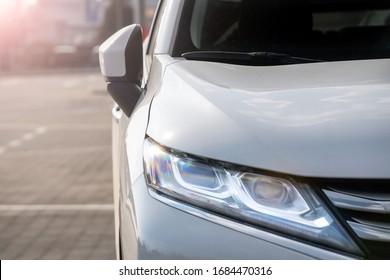 Led Headlight Of A White Modern Car. Modern Trends In The Automotive Industry. Head Optics Of The Machine.