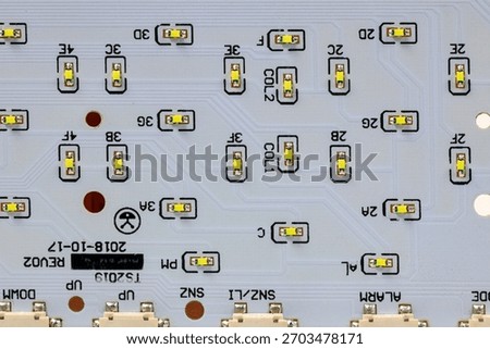 LED light module board, electronic circuit panel with surface mount diodes on gray PCB. 