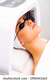 LED Light Therapy Lamp. Facial Phototherapy Procedure In The Salon. Skin Restoration And Treatment At Home.