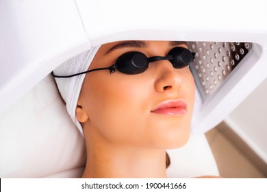 LED Light Therapy Lamp. Facial Phototherapy Procedure In The Salon. Skin Restoration And Treatment At Home.