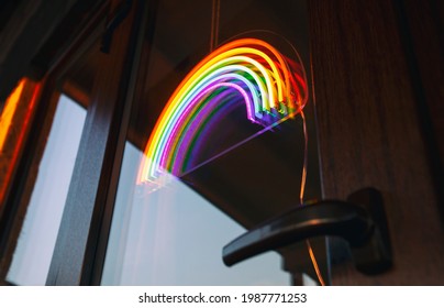 The led neon rainbow hanging on the door entrance in the cafe - Powered by Shutterstock