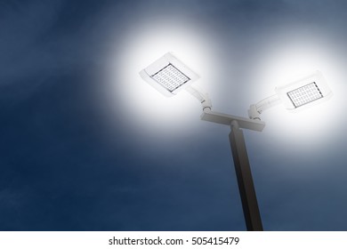 LED Outdoor Car Park Flood Light Working On Night, Saving Energy.