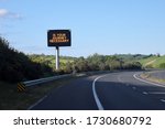 Led sign by the road Is your journey necessary  on the motorway highway Belfast to Dublin