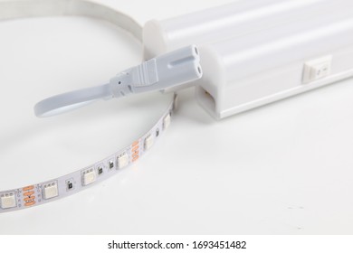 LED strip and LED lamp on white background close-up