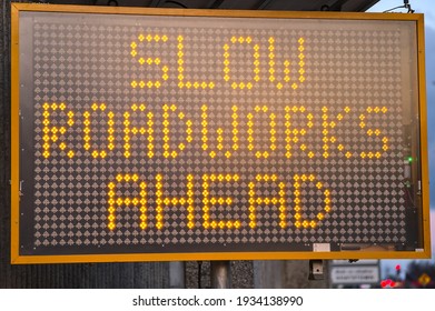 LED Traffic Control Road Sign Solar Powered Message Board Mobile Trailer Variable Message Signs Displaying Slow Roadworks Ahead Along Motorway In Dublin, Ireland