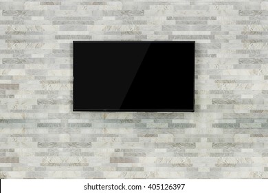 Led Tv Hanging On The Brick Wall Background.