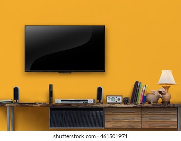 Led tv wooden table media furniture with yellow wall in living room