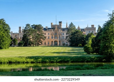 Lednice Chateau with beautiful gardens and parks on sunny summer day