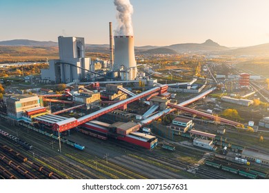 Ledvice, Czech Republic - November 5 2021: Ledvice power plant owned by CEZ. Aerial view of coal power plant with freight railway station. Plant for coal processing.