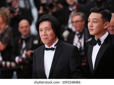 Lee Jong-Dong, actor Steven Yeun attend the screening of 'Burning' during the 71st  Cannes Film Festival at Palais des Festivals on May 16, 2018 in Cannes, France.  