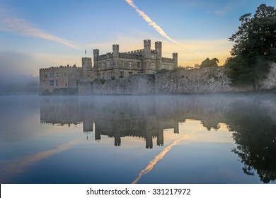 Leeds Castle, Kent, England, at dawn, with mist on the lake.