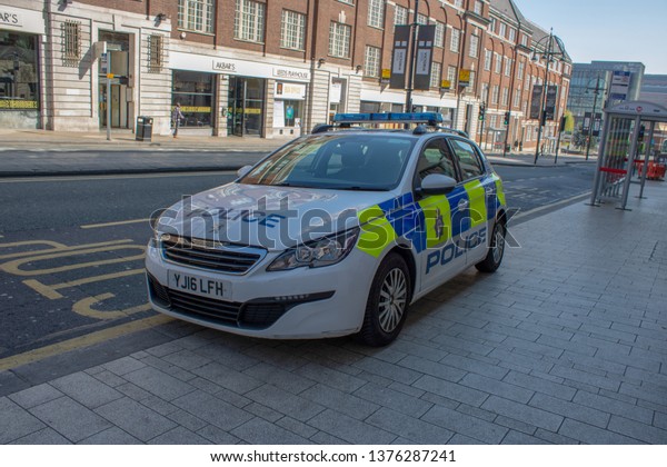 Leeds City Center UK, 21st April 2018: A British UK\
Police car parked in a bus lane in Briggate in the Leeds Town\
Centre on a sunny day 