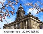 Leeds city, UK. City Hall building. Spring time cherry blossoms.