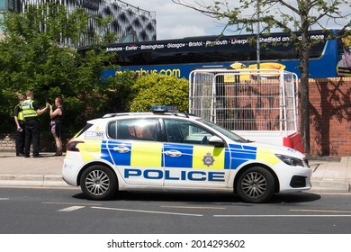 Leeds, Great Britain - June 9th, 2021 : Police Car Parked On The Street Whilst Police Officers Deal With A Situation