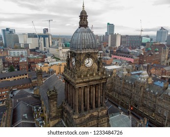Leeds Town Hall in the City of Leeds town centre aerial photo taken on a partly cloudy day with a drone in West Yorkshire showing the clock tower at 8 o'clock 