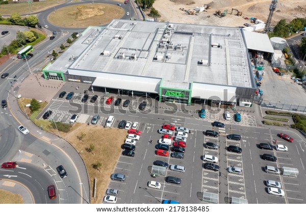 Leeds UK, 14th July 2022: Aerial photo of the Asda\
Supermarket, taken with a drone on a sunny summers day showing the\
supermarket and car park