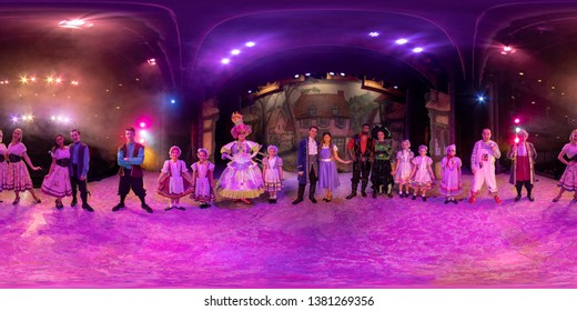 Leeds UK, 20th December 2019: 360 degree panorama sphere photo of people dressed in pantomime costumes taken at the Carriageworks Theatre stage in Millennium Square in Leeds City Centre