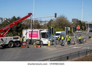 Leeds UK, 5th April 2020:  A Major Accident In The Leeds City Centre Involving A Large Refuse Garbage Truck That Has Crashed And Ended Up On Its Side, Showing A Recovery Truck Preparing To Recover It