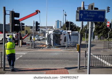 Leeds UK, 5th April 2020:  A Major Accident In The Leeds City Centre Involving A Large Refuse Garbage Truck That Has Crashed And Ended Up On Its Side, Showing A Recovery Truck Preparing To Recover It