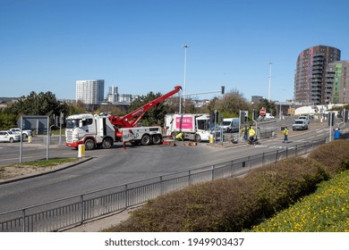 Leeds UK, 5th April 2020:  A Major Accident In The Leeds City Centre Involving A Large Refuse Garbage Truck That Has Crashed And Ended Up On Its Side, Showing A Recovery Truck Preparing To Recover It