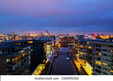 Leeds, UK. Aerial view of Leeds docks, England, UK during the sunset. Heavy clouds over the modern buildings, apartments in the evening and night